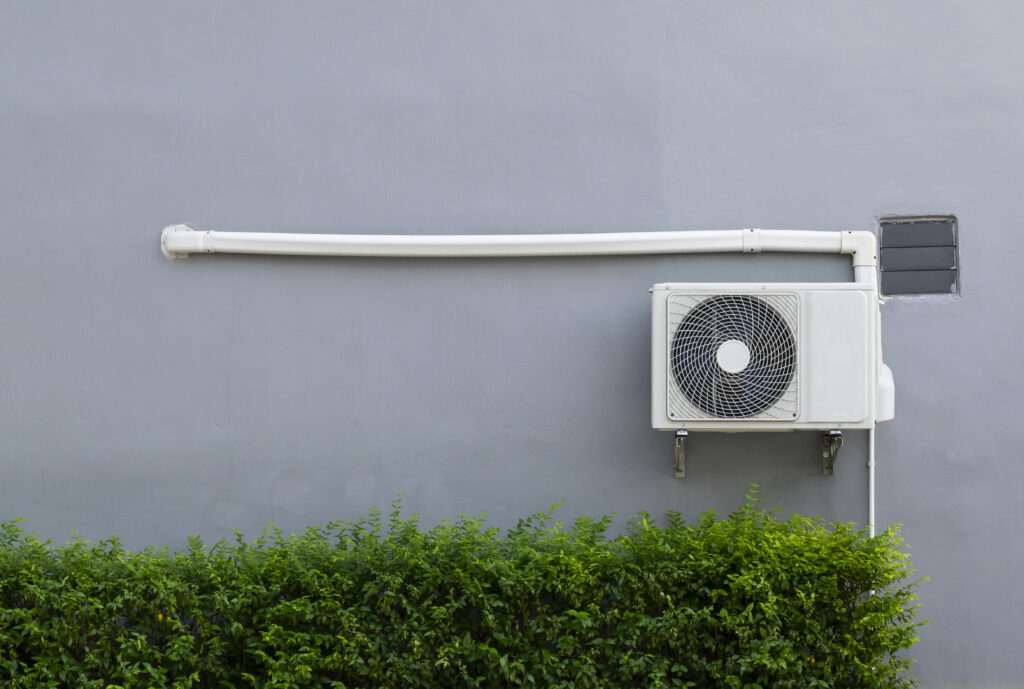 aircon pipe attached to the condenser