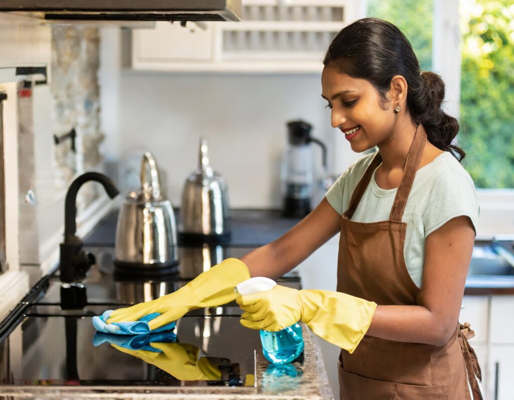 Indian helper cleaning utensils