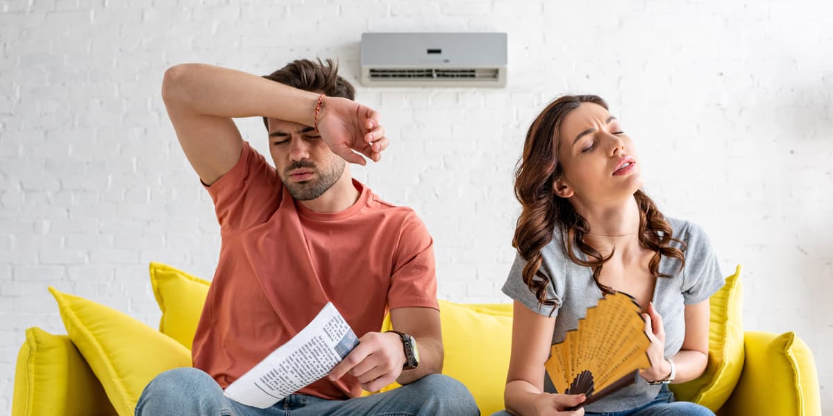 couple perspiring in a living room