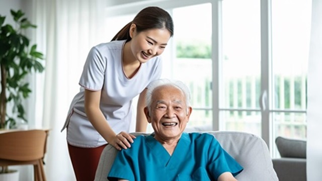 Image of a caregiver with an elderly person