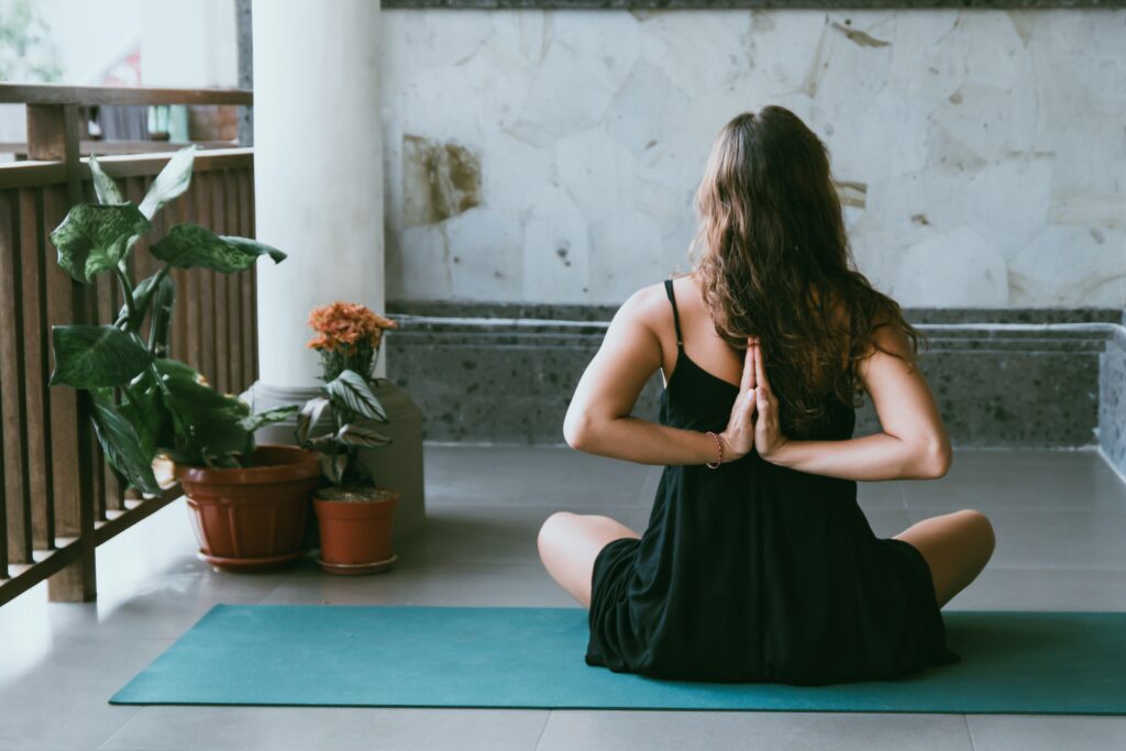 student practicing yoga in a yoga studio