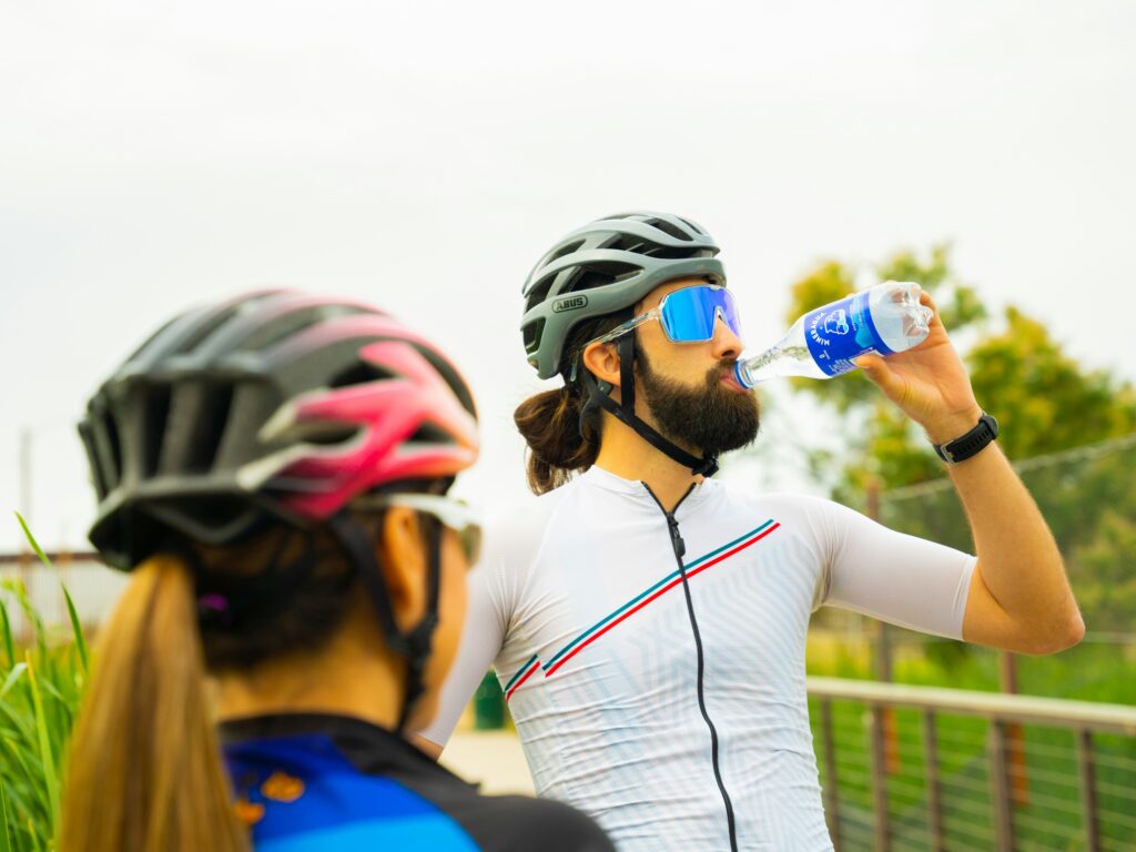 cyclist drinking electrolyte-rich drink