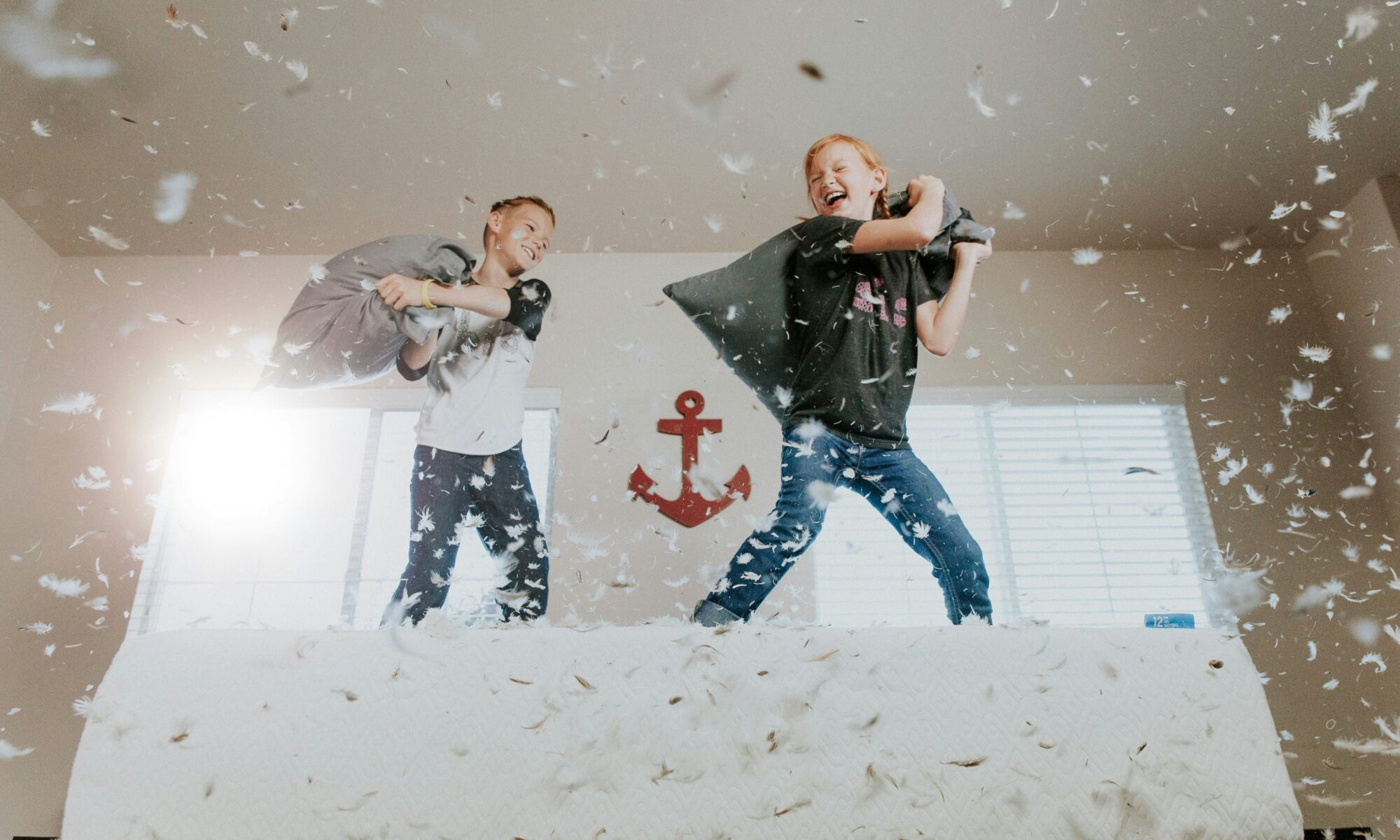 kids playing pillow fight