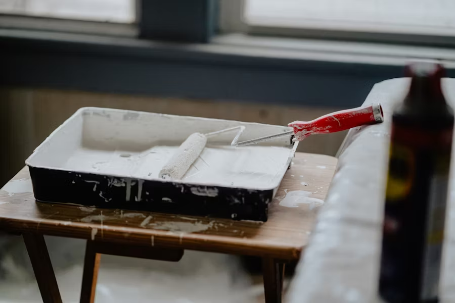 paint roller in a paint tray
