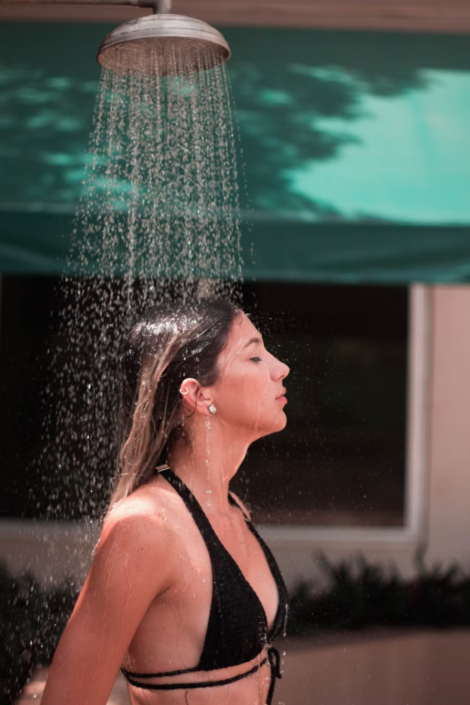 woman taking an outdoor shower